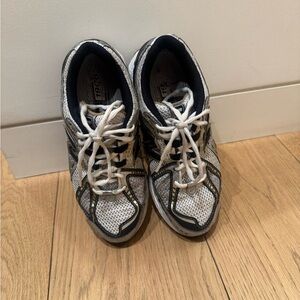 New Balance Black and Gold Sneakers